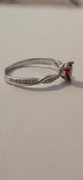 Crimson Twist red CZ heart ring – side angle