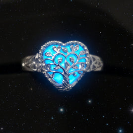 Silver ring with blue gemstone on a black background